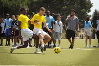 a group of people watching a soccer game