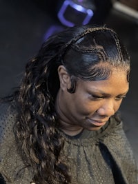 a woman is getting her hair done in a salon