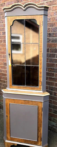 a grey and wood hutch with a mirror on it