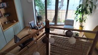 a living room with a wooden railing