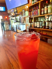 a drink with a cherry on top