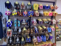 a display of shoes and sandals in a store