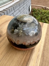 a small terrarium with rocks and crystals in it