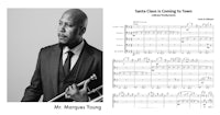 a picture of a man in a suit and a sheet of music