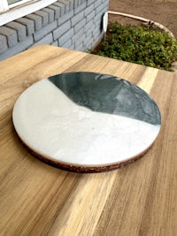 a blue and white plate on a wooden table