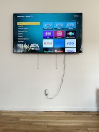 a tv mounted on a wall in a room