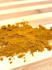 turmeric powder on a wooden table