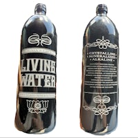 two bottles of living water on a white background