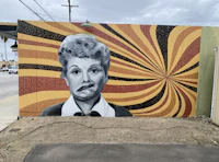 a mural of a woman with a face painted on it