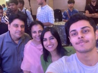 a group of people taking a selfie at an event