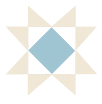 a blue and white quilting star on a black background