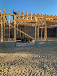 a house under construction with wood framing