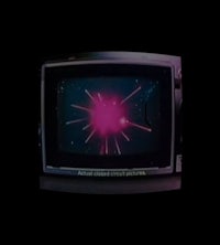 a tv screen with a pink light on it