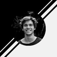 a black and white photo of a smiling man