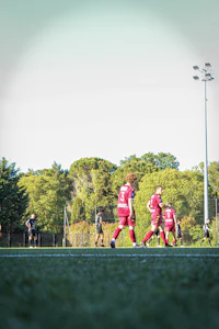 a group of kids playing soccer on a field