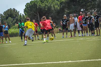 a group of people watching a soccer game