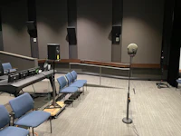 a room with chairs and a microphone