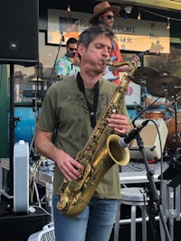 a man playing a saxophone