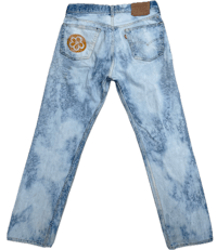 a pair of levi's jeans with a patch on the back