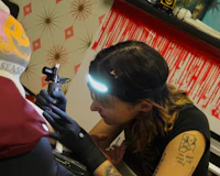 a woman getting a tattoo