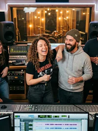 a group of people in a recording studio