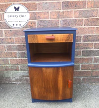 a blue and brown nightstand with a drawer