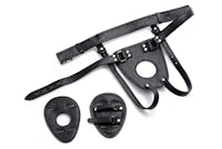 a pair of black leather harnesses and a pair of leather cuffs