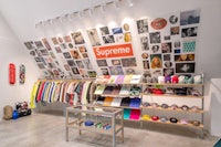 a store with a lot of clothes and skateboards