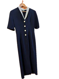 a navy dress on a hanger with a collar