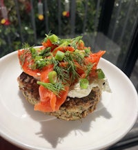 a plate with salmon and dill on it