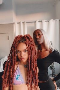 two women with dreadlocks posing for a photo