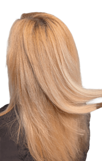 a woman with blonde hair blowing in the wind