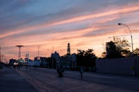 a boardwalk with people walking on it
