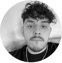 a black and white photo of a man with curly hair