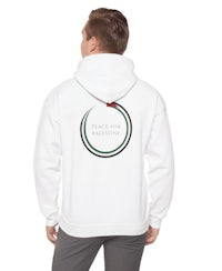 the back of a man wearing a white hoodie with a circle on it