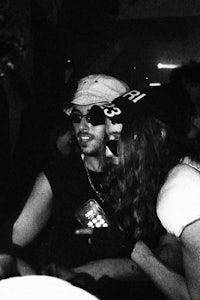 black and white photo of a group of people at a party