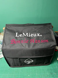 a black bag with the word lemieux on it