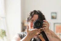 a woman taking a picture with her camera