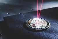 a coin with a laser on top of it