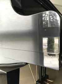 a close up view of a silver piano