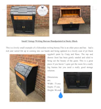 a black writing desk with drawers and a drawer