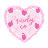 a pink heart shaped cake with the words i love you