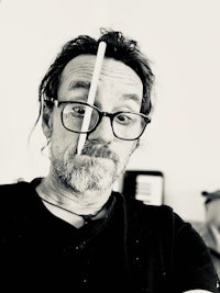 a man with a toothpick in his mouth