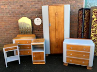 a group of furniture in front of a brick wall