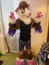 a person in a mascot costume standing in front of a door