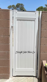 a white gate with the words bright light home on it