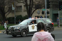 a police car driving down the street