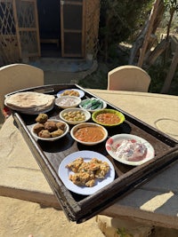a tray of food on a table outside