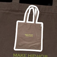 a brown tote bag that says make hip hop