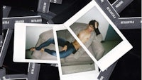 a photo of a man laying on a couch